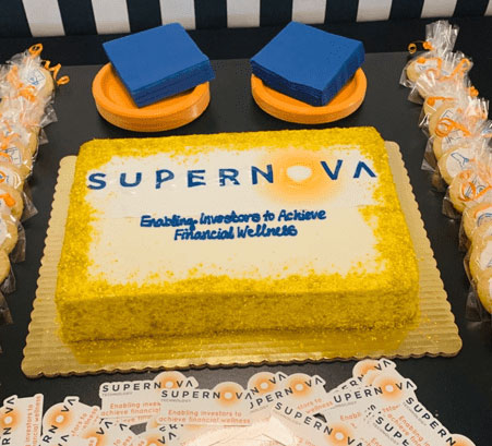 A cake with the Supernova logo imprinted in the icing