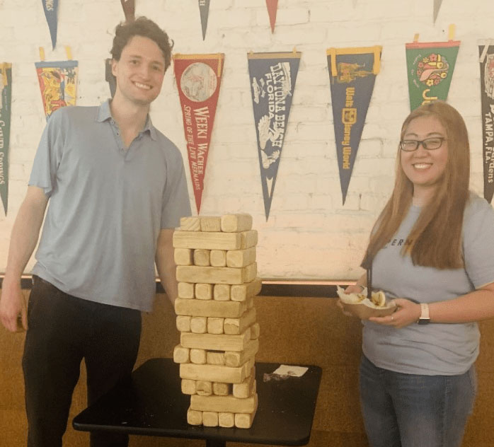 Team members Will and Junyan playing Jenga